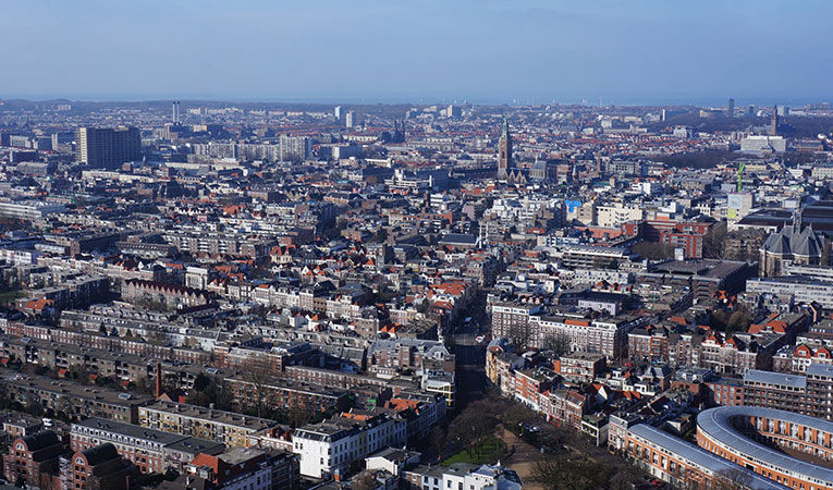 Cityscape of The Hague under cloudy blue sky