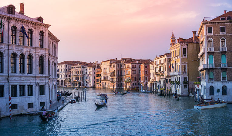 Canals of Venice under a purple sky