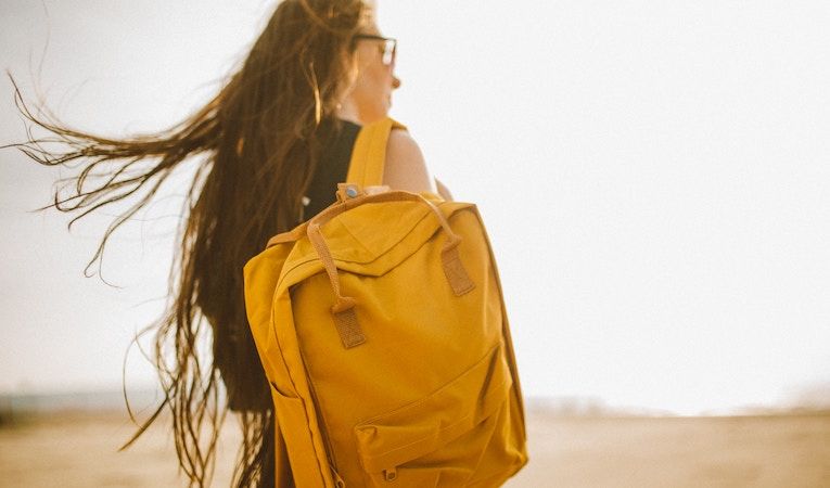 Woman carrying backpack to esl lessons