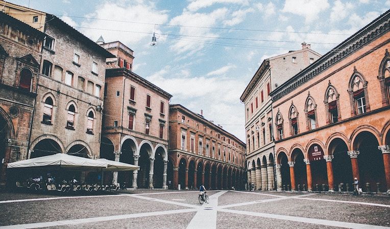 riding bike across the square in Bologna, Italy 